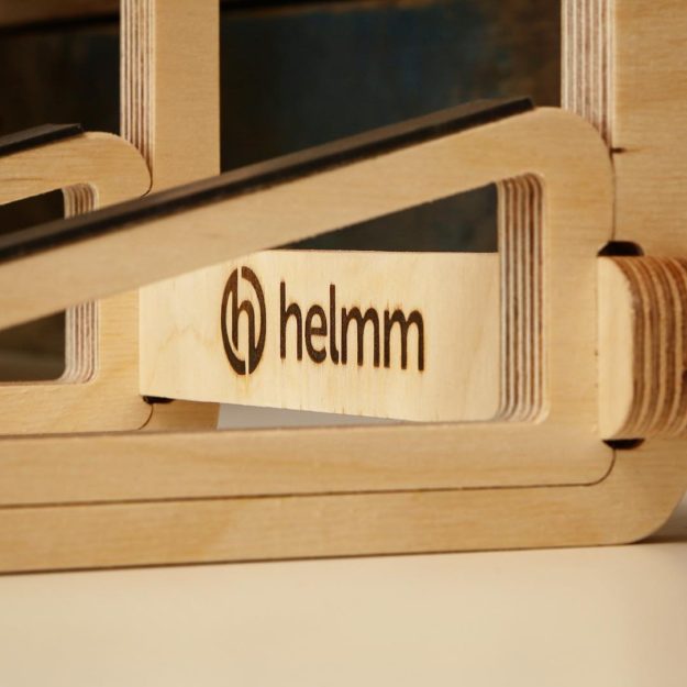 A close up of La-Stand. After CNC manufacturing, each component is hand sanded, silicon rubber strips are applied to protect your devices and the Helmm logo is hot branded into the cross brace – all by us, at our UK workshop. Register on our website in May for a discount code! Link in bio