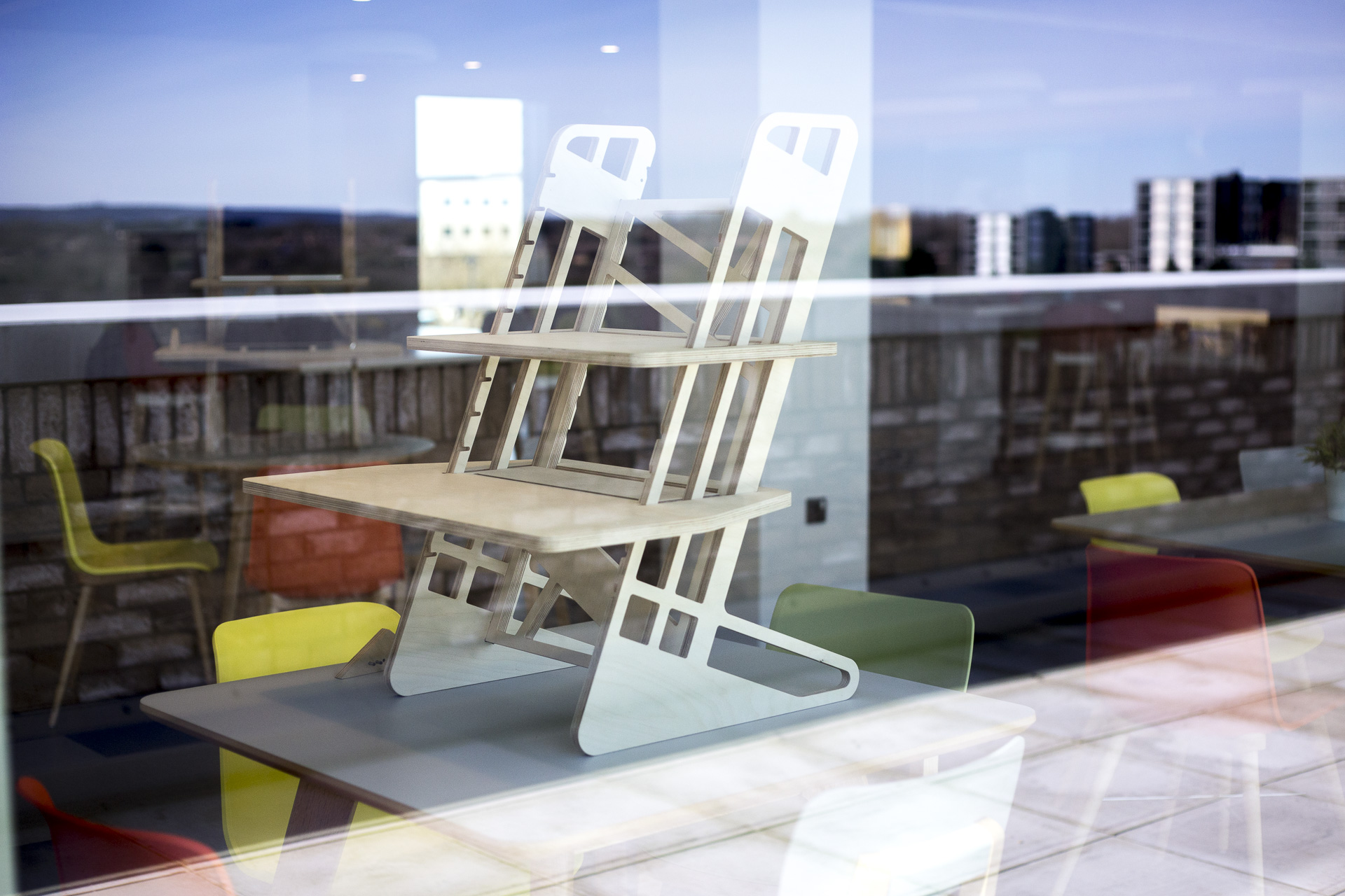 Reflections in the glass of our standing desk